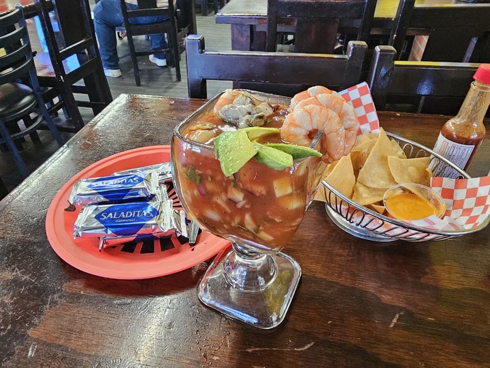 Printed menu with tacos, burritos, and ceviches.