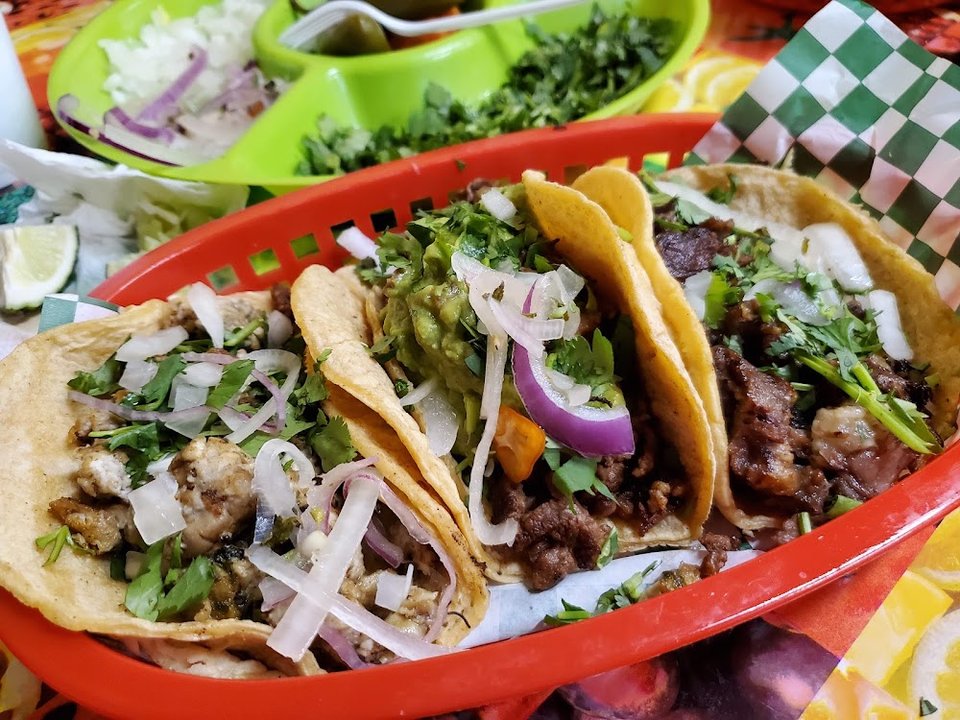 Printed menu with tacos, burritos, and ceviches.