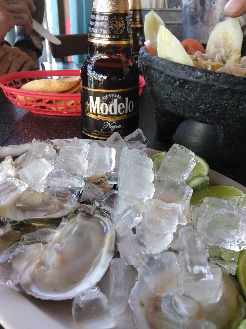 Restaurant menu highlighting carnitas and mariscos.
